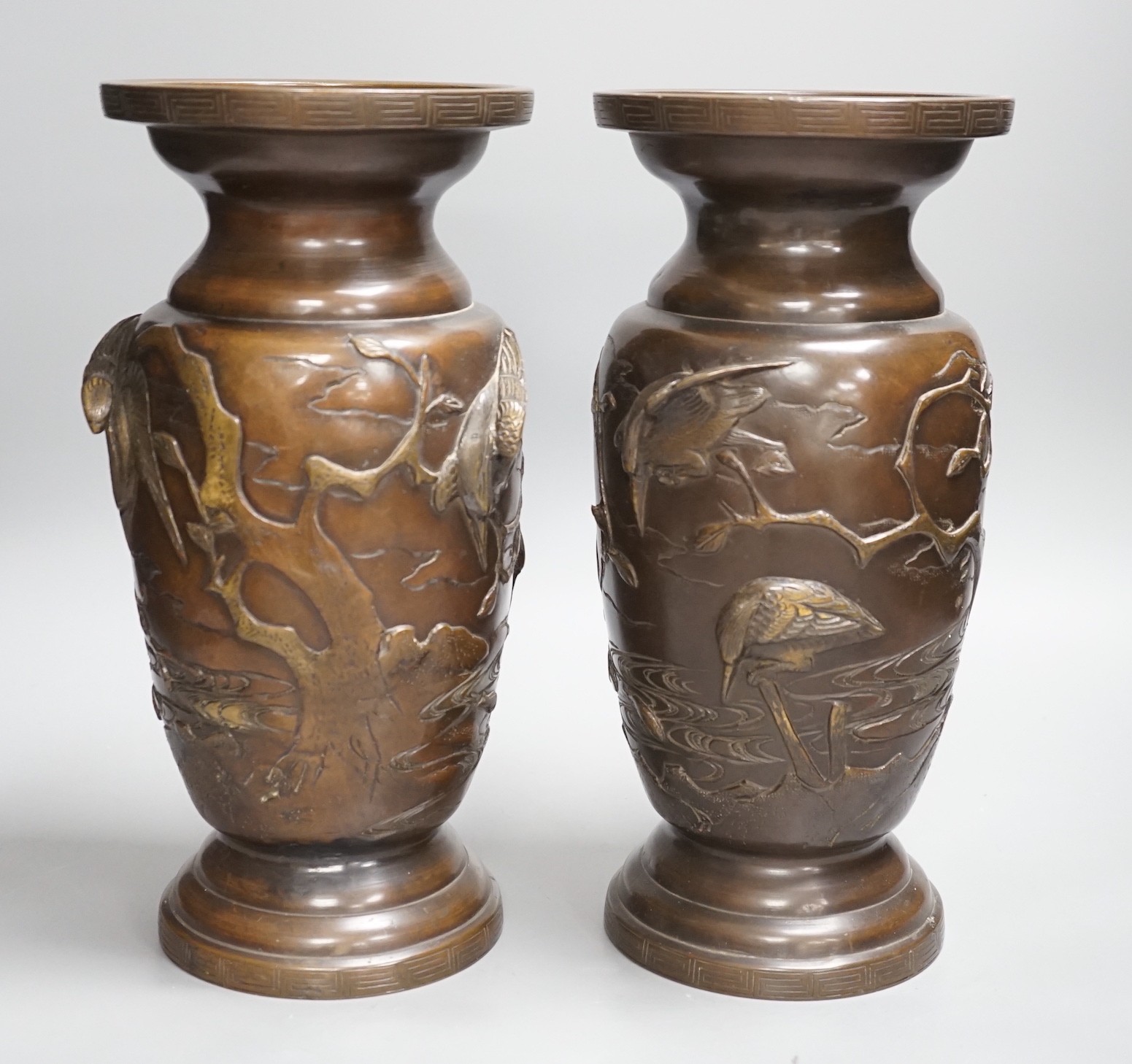 A pair of Japanese bronze vases, Meiji period, 29cms high